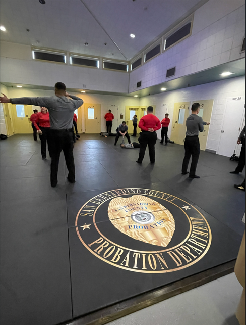 Students at the San Bernardino County Probation Department practice for the Arrest and Control Exam.