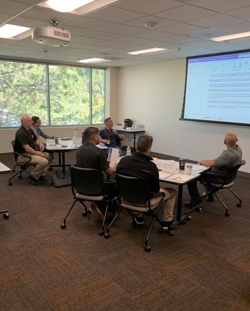 Subject matter experts gather at POST HQ in West Sacramento to review the workbook for Learning Domain 21, Patrol Techniques.