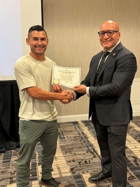 Mario Moreno give congrats to Alexzander White
