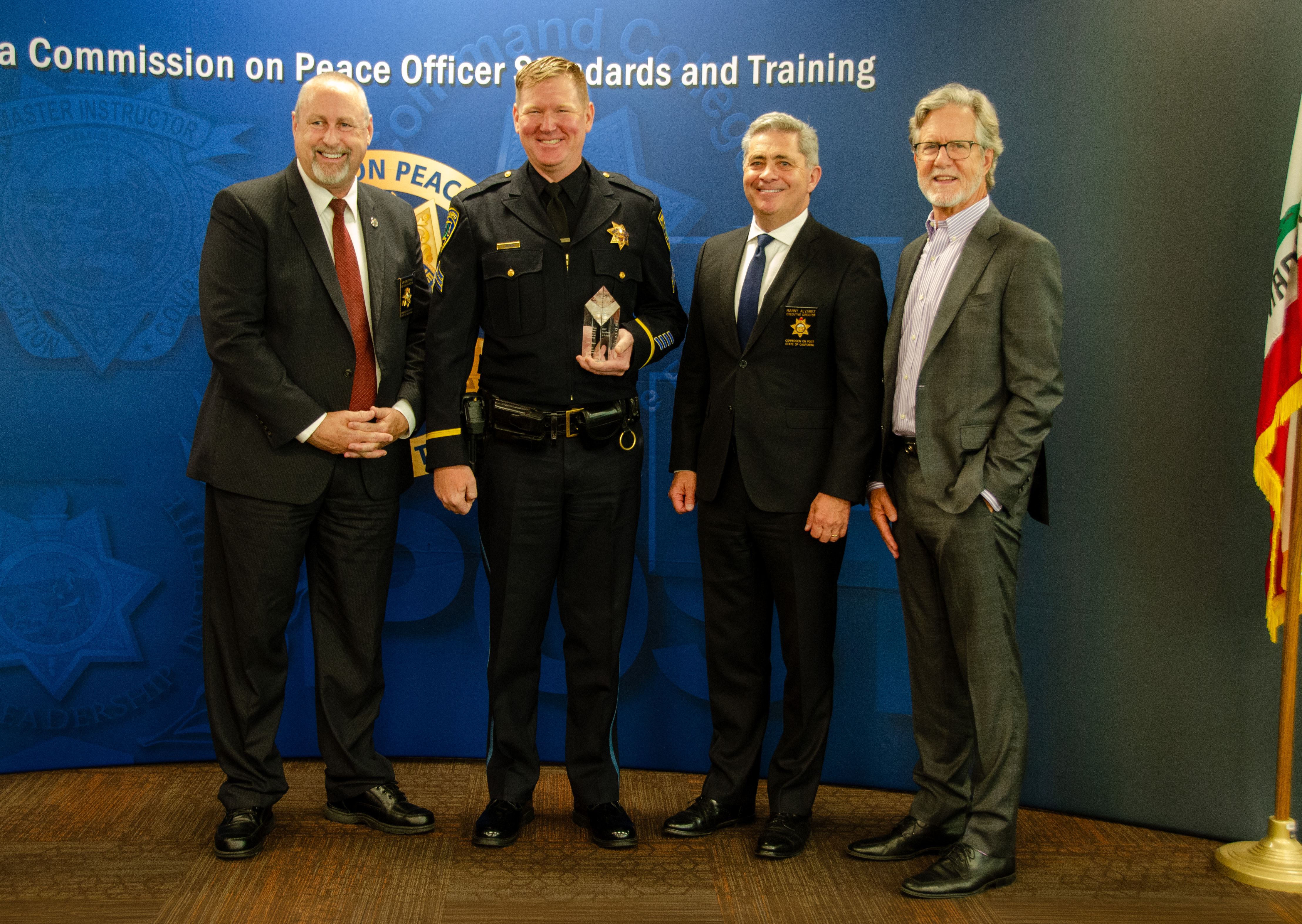 Sergeant Scott Olcese receiving 2025 Individual Achievement Award