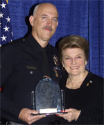George L. Shake (left) from the Los Angeles Police Department accepts his award from POST Commission Chair Collene Campbell
