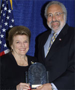 Attorney at Law Martin (Marty) J. Mayer (right) accepts his award from POST Commission Chair Collene Campbell