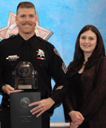 Sergeant Raymond Backman (left) from the Oakland Police Department accepts his award from Deputy Director Lindsay E. Barsamian-Kelsch, Office of Governor Arnold Schwarzenegger, Fresno Field Office
